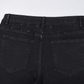 Smalpassade svarta jeans med strassdekorationer