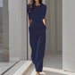 Kvinnlig jumpsuit med vida ben i enfärgad design