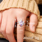 Asymmetrisk ring med marquise-slipad lila zirkon